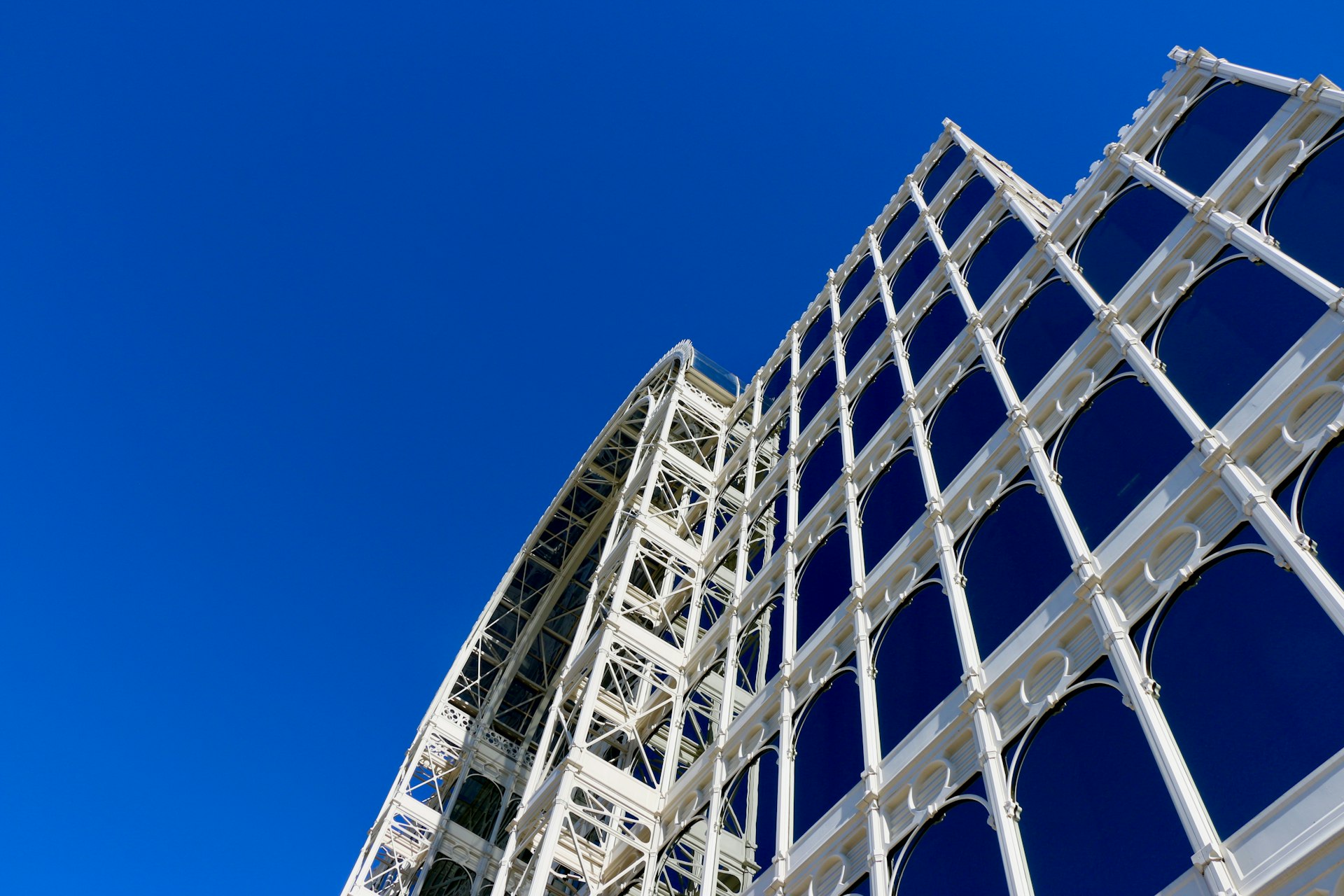 low-angle photography of white and blue building